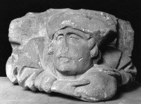 Kraagsteen met mannelijke figuur met steen of brood in de handen